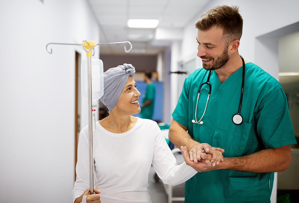 Doctor Holding Hands with Cancer Patient