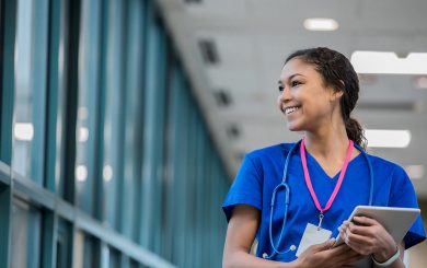Young Nurse Looking Through Window