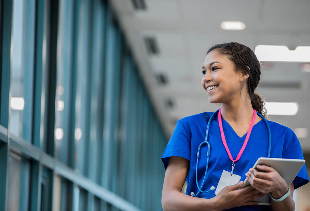 Young Nurse Looking Through Window