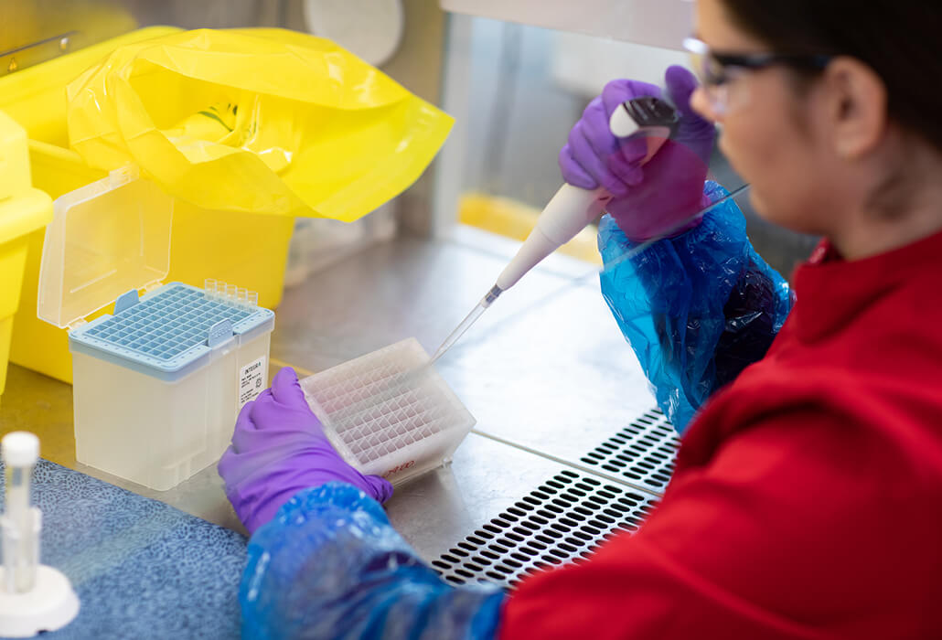 Women Scientist Taking Samples in Lab