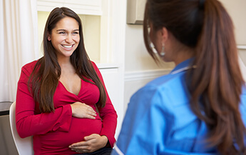 Pregnant Woman Meeting with Nurse